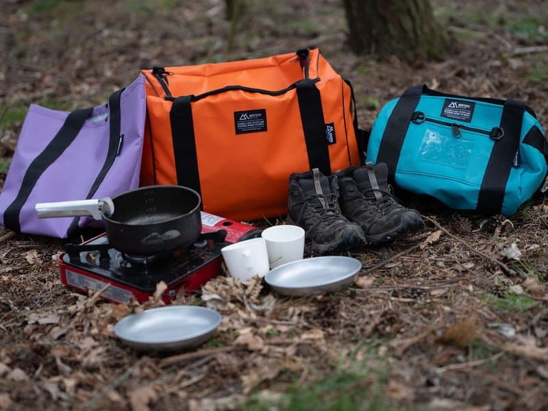 Camping gear and Montrose waterproof bags in the woods