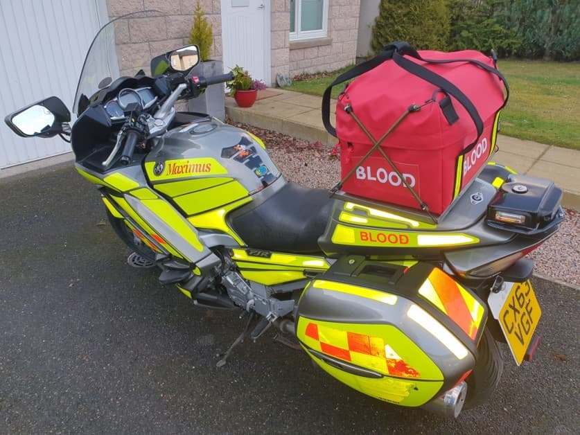 Custom blood-transport bag on an emergency response motorcycle