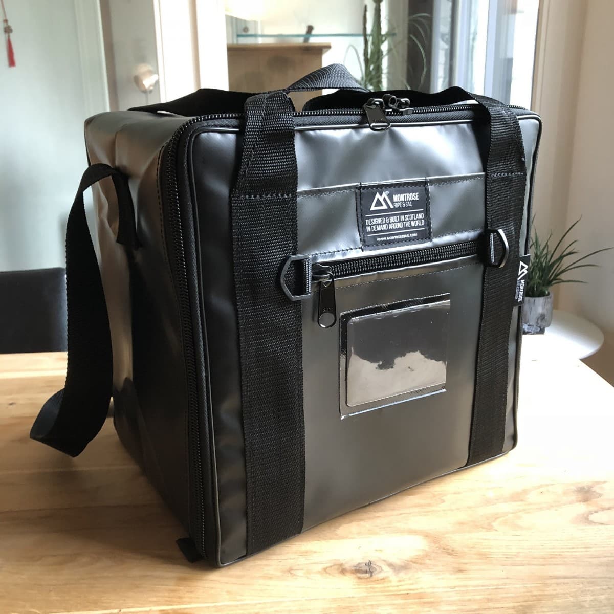 Bespoke case with a welded Montrose branding label and ID window